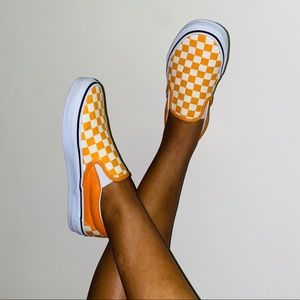 Orange checkered Vans.